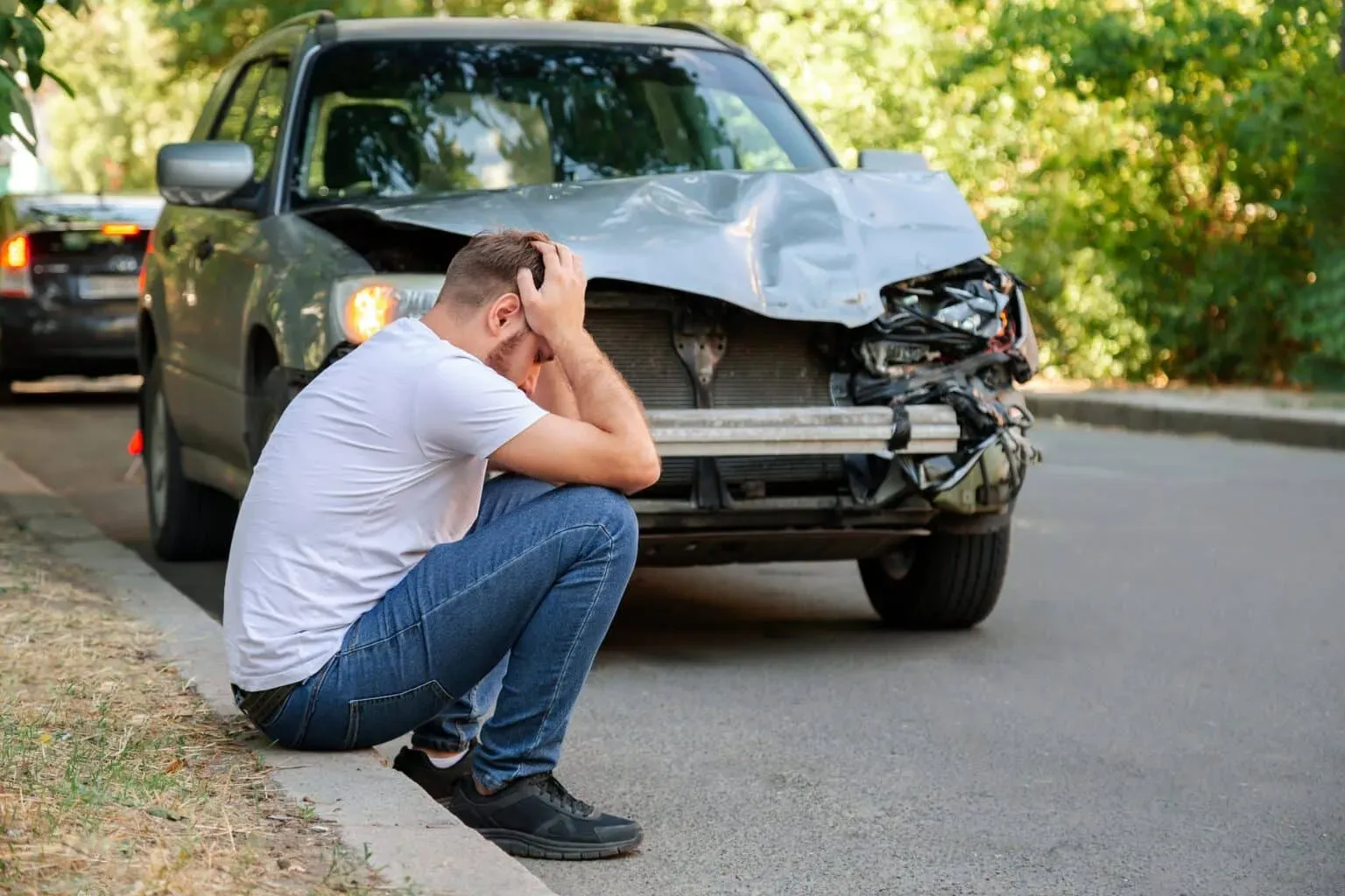bigstock-Car-Accident-Man-Holding-His-423850211-min-1536x1024.webp