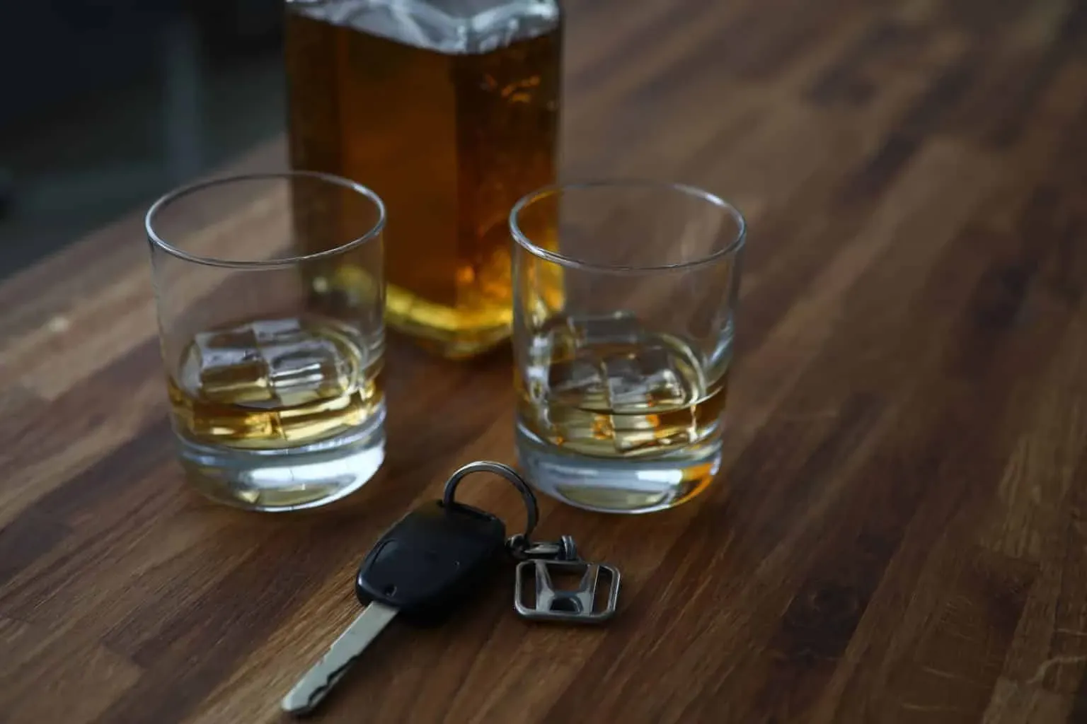 bigstock-Car-Key-Lies-On-Table-Next-To-353630270-1-min-1536x1024.webp