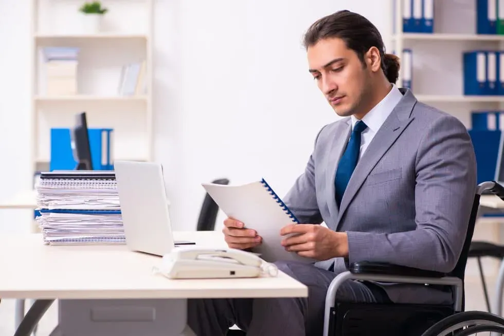 bigstock-Disabled-employee-in-the-offic-384132059-980x654.webp