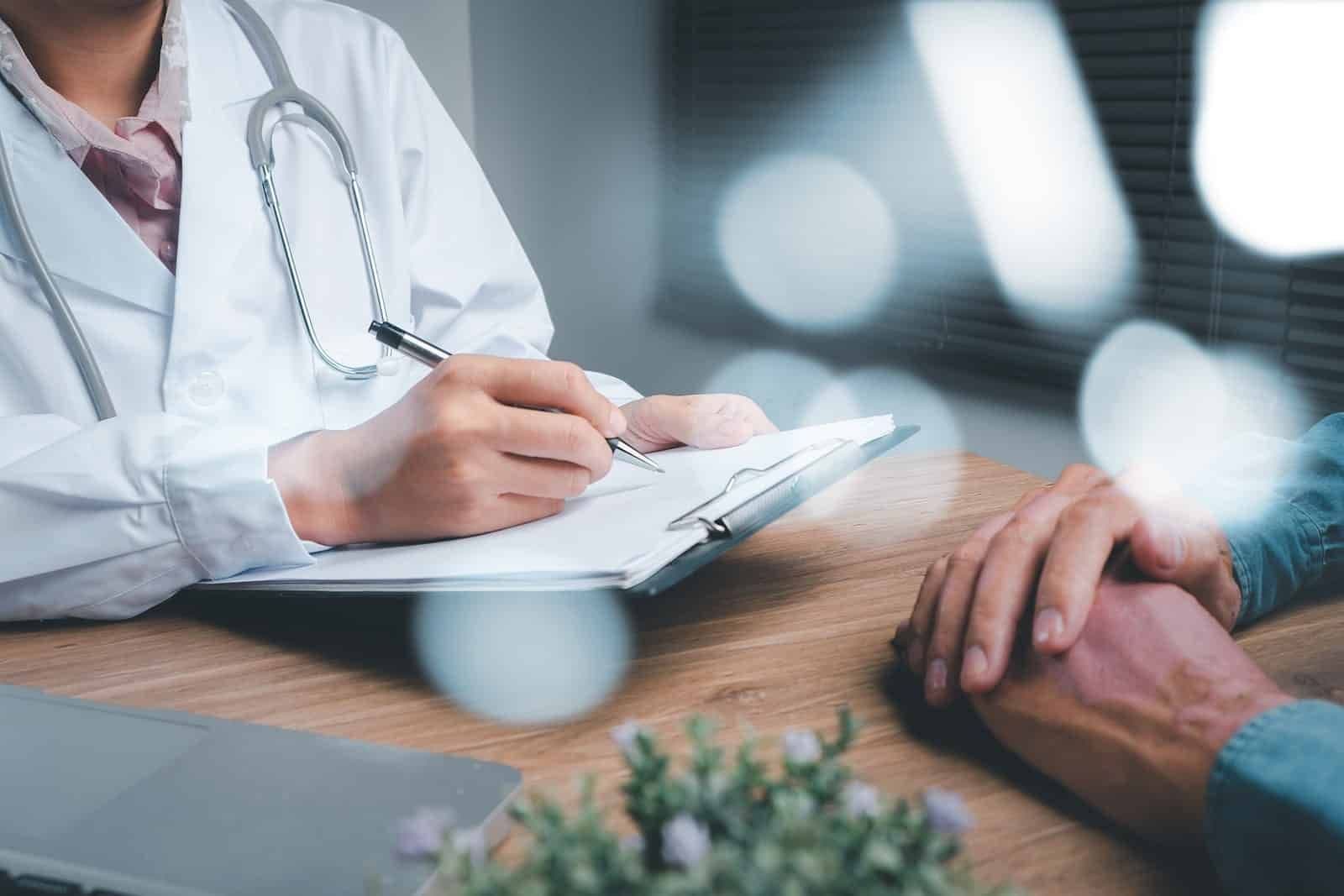 bigstock-Doctor-And-Patient-Are-Discuss-439717991-min