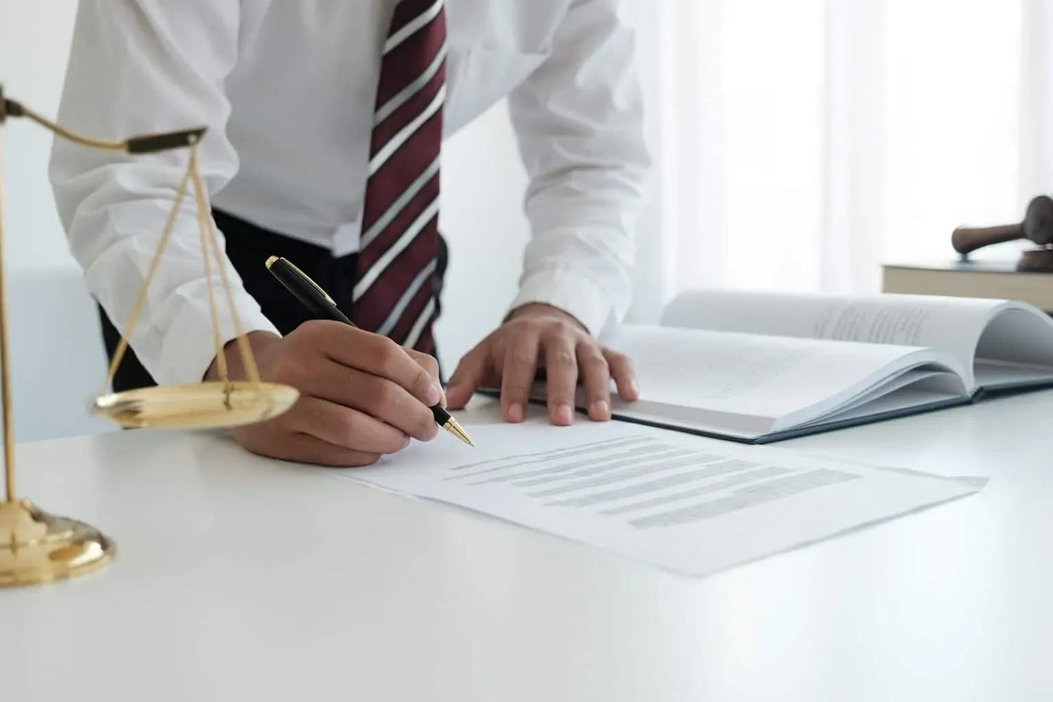 bigstock-Lawyer-Sitting-Working-At-The-457208169-1536x1024.webp