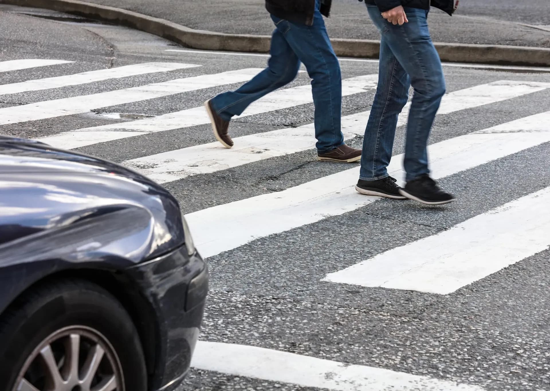 bigstock-pedestrian-crossing-and-car-at-439500857-min-1-scaled.webp