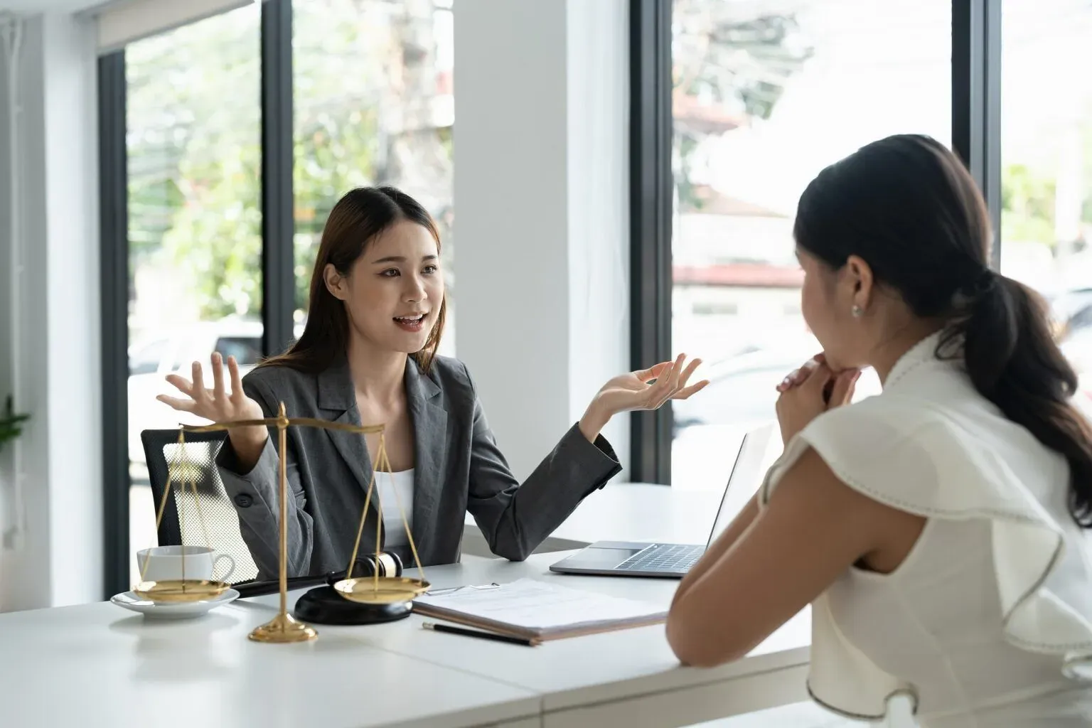 bigstock-The-Young-Lawyer-Talks-To-Nego-461511053-min-1536x1024.webp