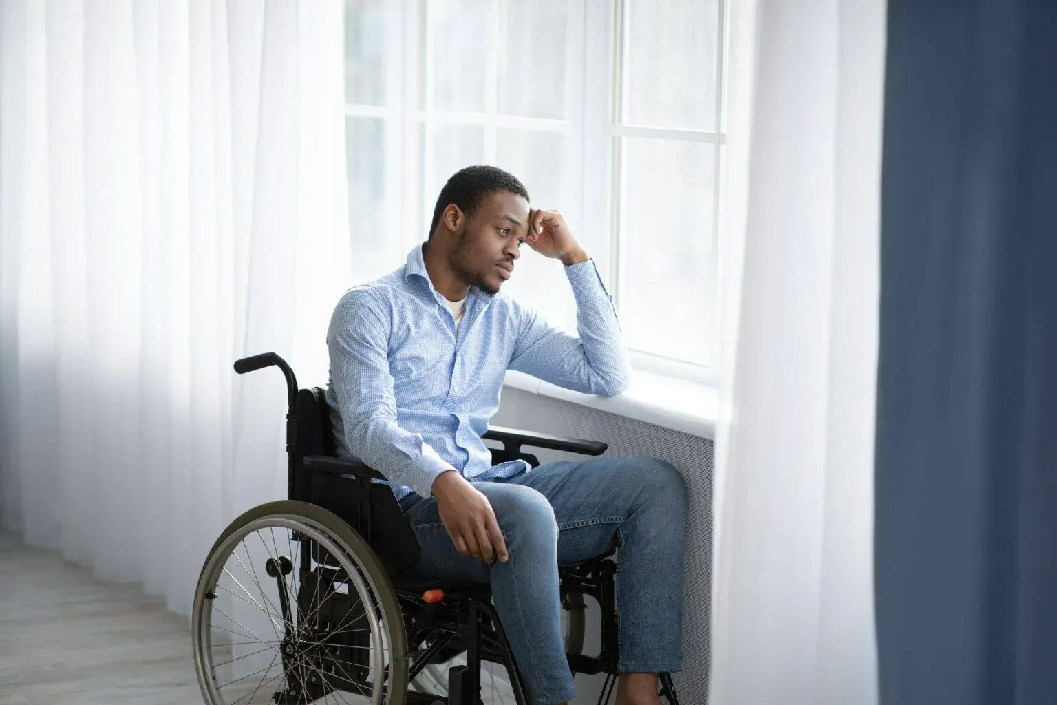 bigstock-Unhappy-Black-Handicapped-Guy-410290588-min-1536x1024.webp