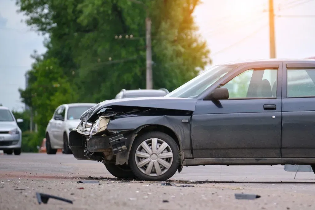 damaged-in-car-accident-vehicle-on-city-street-cra-2024-12-06-16-31-07-utc-1024x683.webp