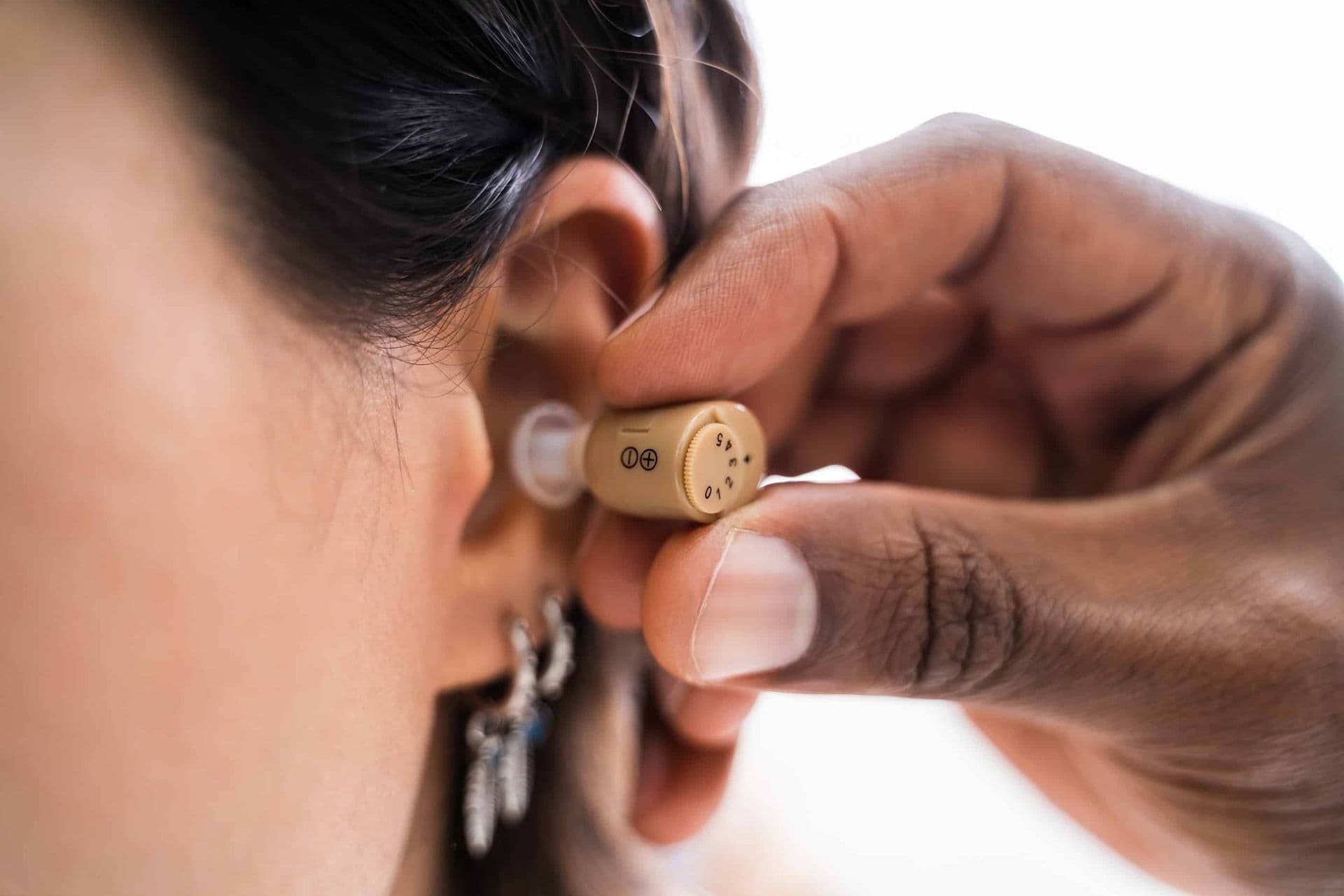 imgi_32_bigstock-Doctor-Inserting-Hearing-Aid-I-361613575-min.jpg