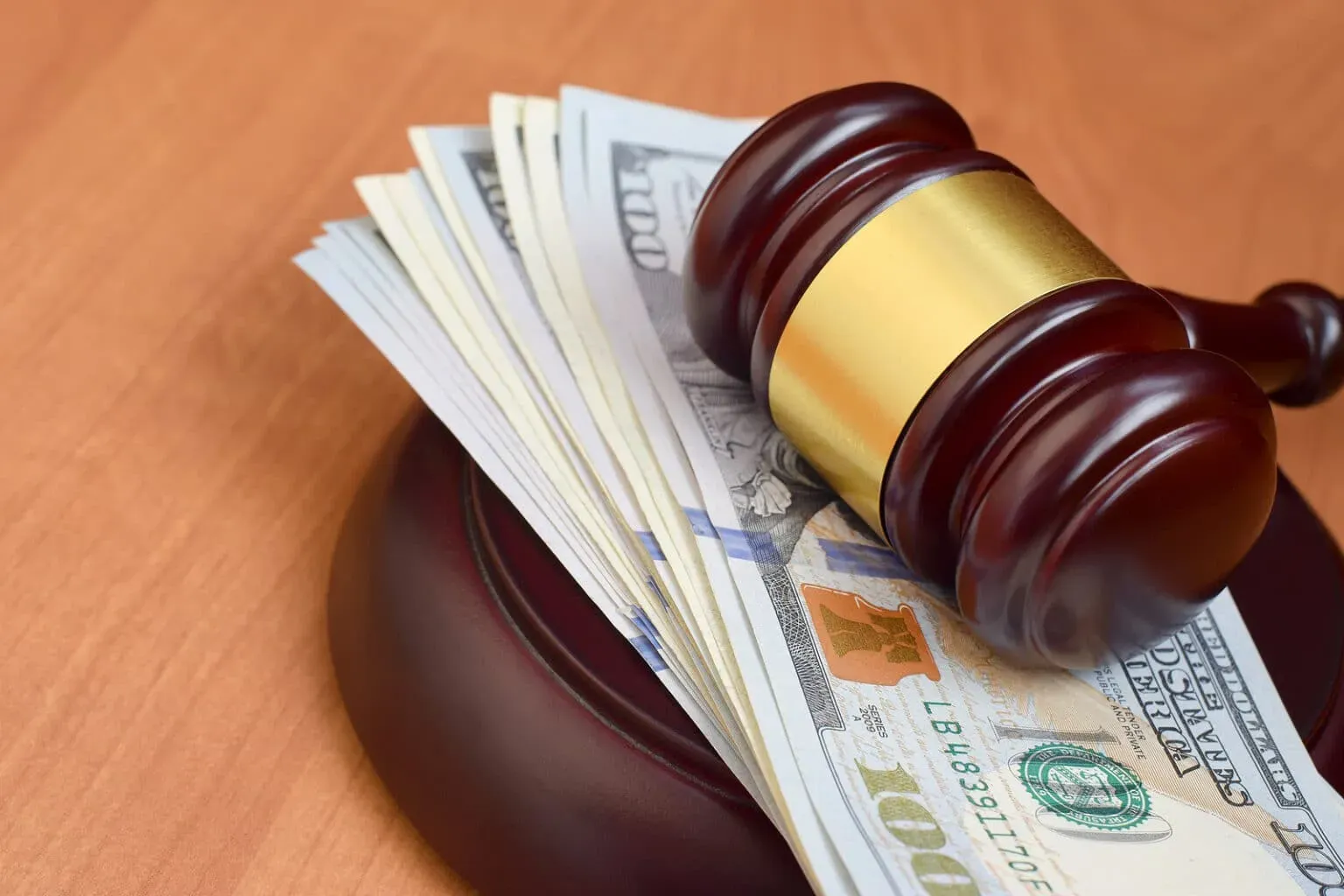 judge-gavel-and-money-on-brown-1536x1024
